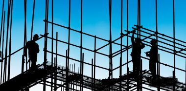 construction worker on construction site at dusk